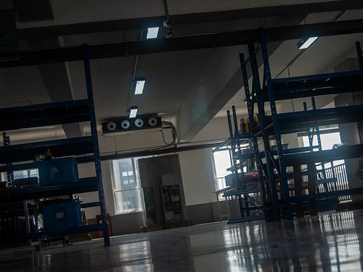 Dumbwaiter vs material lift: a service lift car and guide rail in a warehouse rack setting